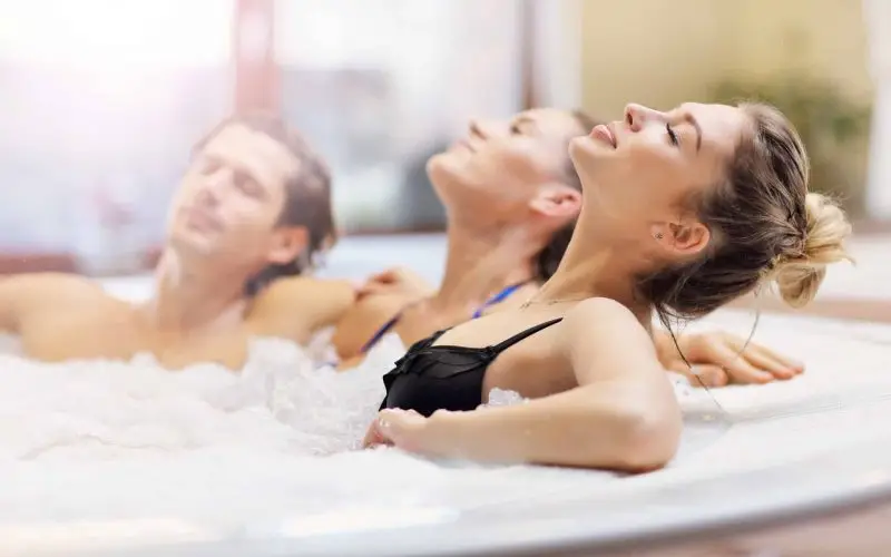 Relaxing-in-a-hot-tub-wellness shop spas