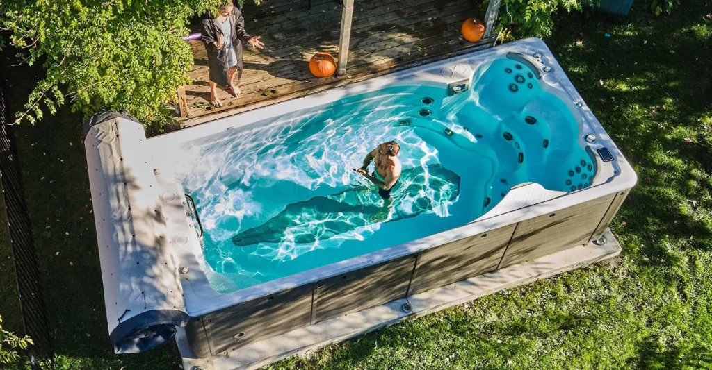 man standing on a swim spa