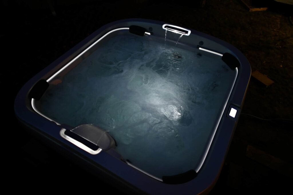 outdoor jacuzzi hot tub at night