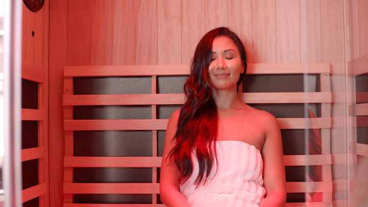 woman enjoying an indoor infrared sauna