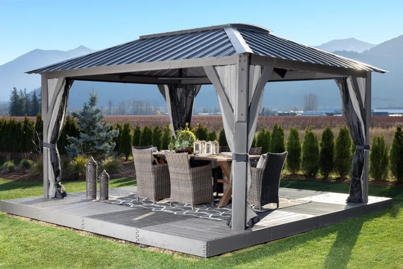 outdoor gazebo with a dining set