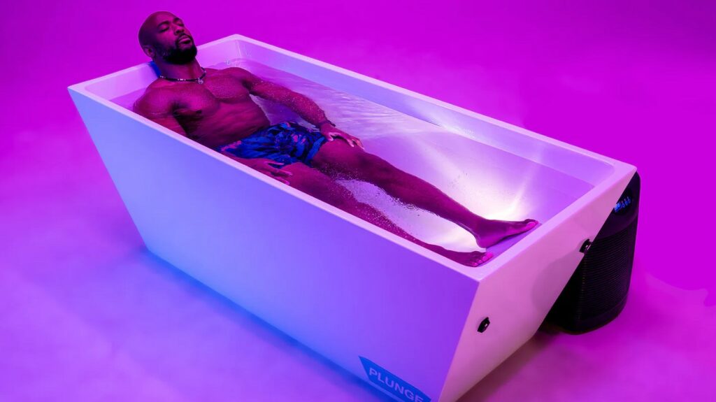 man in plunge tub enjoying cold water therapy benefits