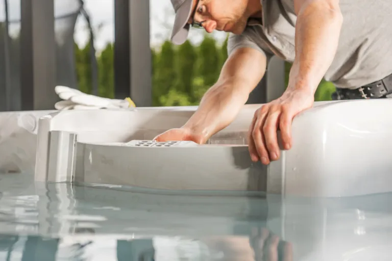 A technician doing regular hot tub maintenance