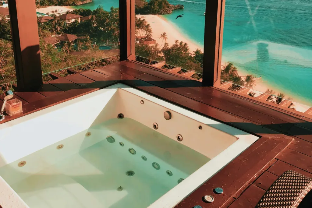 a hot tub overlooking a beach