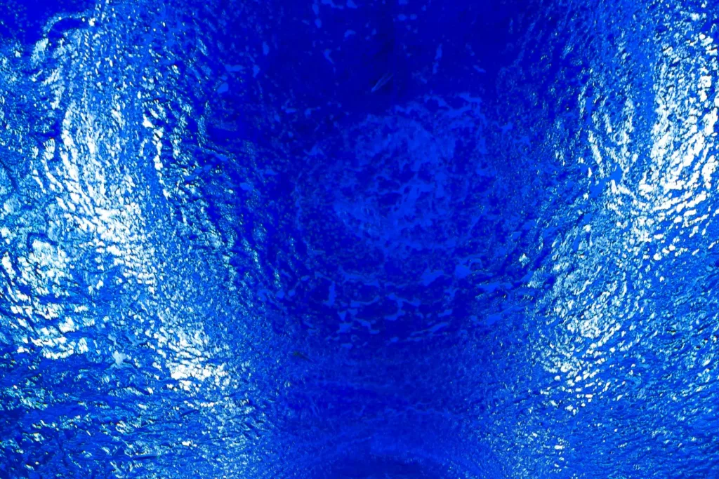 a close-up of water lit with a blue light