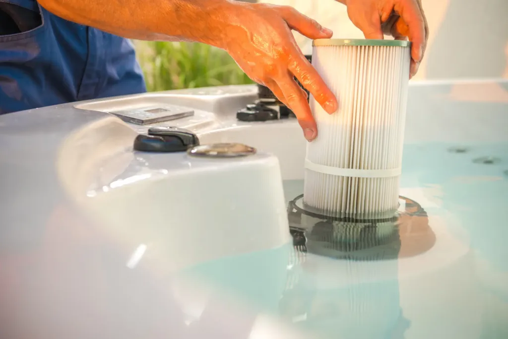 A technician replacing a hot tub filter